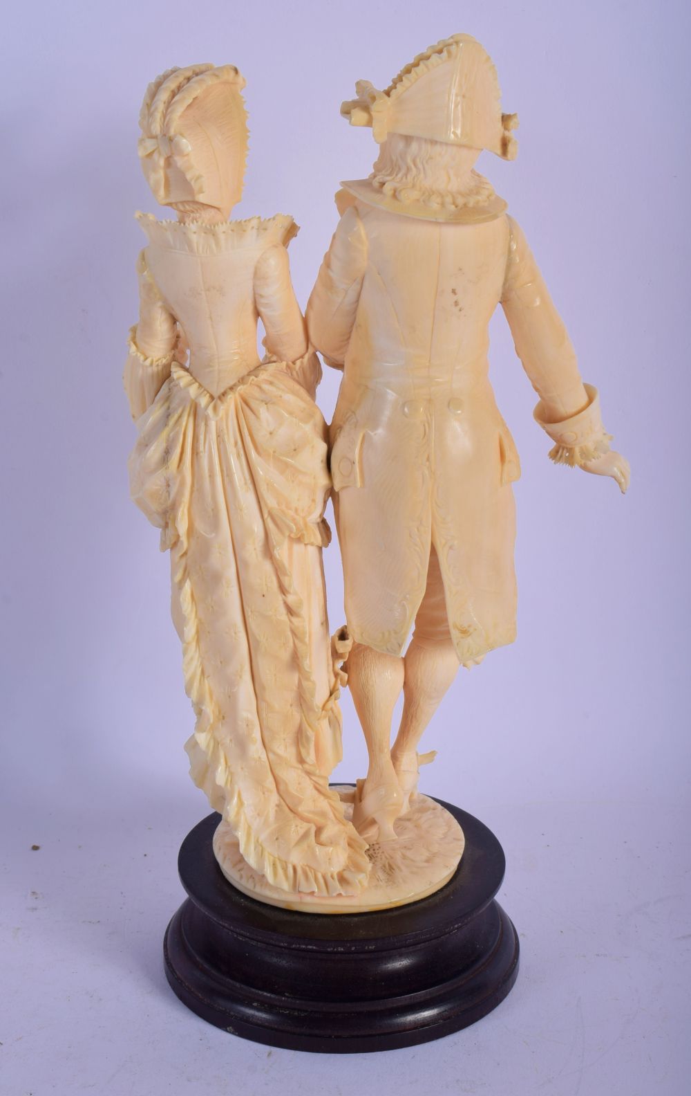 A 19TH CENTURY EUROPEAN CARVED IVORY FIGURAL GROUP modelled as a dandy and female upon a wooden base - Image 2 of 3