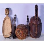 A collection of Tribal items including a feeding bowl, Yoruba mask, fly swats and a middle Eastern p