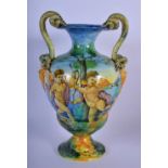 A 19TH CENTURY ITALIAN TWIN HANDLED MAJOLICA FAIENCE CANTAGALLI VASE painted with putti within lands