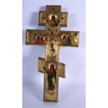 A 19TH CENTURY RUSSIAN SILVER MOUNTED PAINTED WOOD ICON CRUCIFIX decorated with saints. 34 cm x 17 c