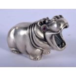 A CONTINENTAL SILVER HIPPOPOTAMUS WITH GEM SET EYES. 7.9cm x 4.9cm, weight 73g