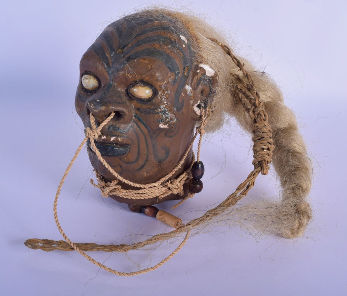 A VERY RARE EARLY 20TH CENTURY TRIBAL WAX TREE GUM SHRUNKEN HEAD decorated with tattoos. 20 cm x 12 - Image 2 of 4