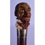 A RARE ANTIQUE PAINTED IVORY BLACKAMOOR HEAD WALKING CANE with silver mounts. 89 cm long.