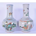 A pair of Chinese famille verte porcelain vases decorated with figures 27.5cm.