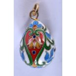 A CONTINENTAL SILVER AND ENAMEL EGG SHAPED PENDANT. 3.2cm x 2cm, weight 8.8g