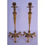 A FINE PAIR OF 19TH CENTURY FRENCH GILT BRONZE AND ENAMEL CANDLESTICKS decorated with foliage. 33 cm
