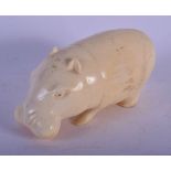 AN EARLY 20TH CENTURY AFRICAN CARVED IVORY FIGURE OF A HIPPO C1920. 9 cm x 4 cm.