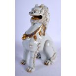 A FINE EARLY 20TH CENTURY JAPANESE MEIJI PERIOD PORCELAIN FIGURE OF A BUDDHISTIC LION modelled scowl