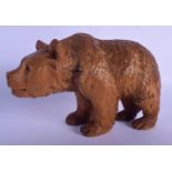 A 19TH CENTURY BAVARIAN BLACK FOREST FIGURE OF A ROAMING BEAR of naturalistic form. 21 cm x 14 cm.