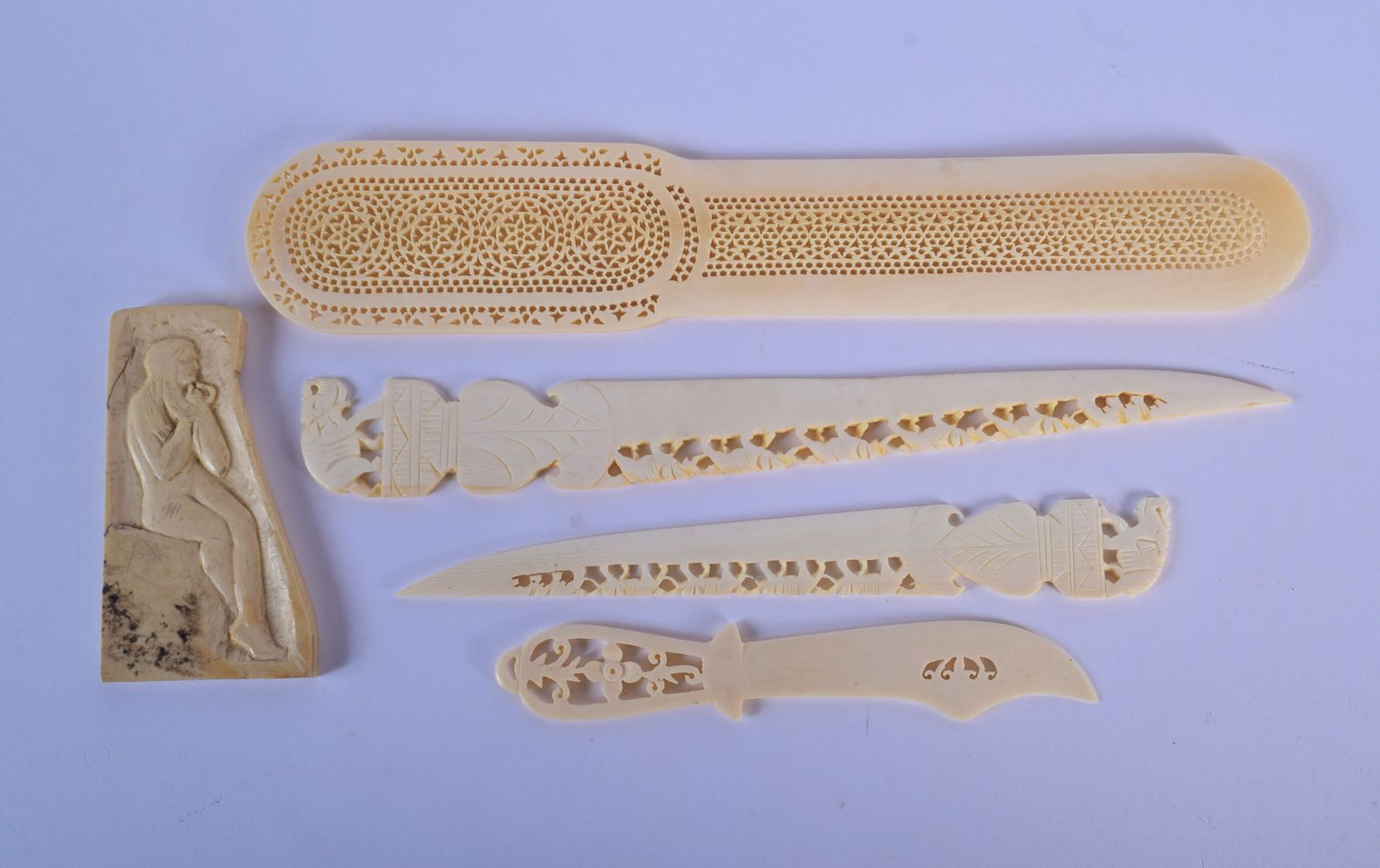 A 19TH CENTURY ANGLO INDIAN CARVED IVORY LETTER OPENER together with similar wares. Largest 24 cm lo - Image 2 of 2