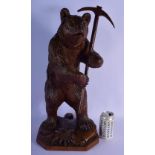 A RARE LARGE 19TH CENTURY BAVARIAN BLACK FOREST CARVED WOOD FIGURE OF A BEAR modelled holding a pick