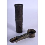 AN ISLAMIC BRONZE OIL LAMP TOGETHER WITH A BRONZE BRUSH POT. Lamp 11cm long