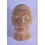 A 19TH CENTURY EUROPEAN GRAND TOUR ETRUSCAN TYPE TERRACOTTA HEAD After the Antiquity. 13 cm x 5 cm.