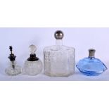 FOUR VINTAGE SILVER TOPPED GLASS BOTTLES. Largest 18 cm x 10 cm. (4)