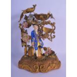 A RARE EARLY 19TH CENTURY FRENCH PARIS PORCELAIN AND GILT METAL FIGURE modelled as a male holding a