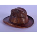 A RARE ANTIQUE BLACK FOREST NOVELTY GENTLEMANS TREEN CARVED WOOD INKWELL in the form of a hat. 12 cm
