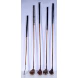 A collection of antique hickory shafted golf woods together with a another club 112 cm (5)