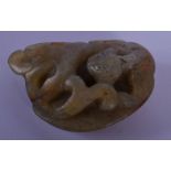 A SMALL 19TH CENTURY CHINESE CARVED JADE TOGGLE Qing, overlaid with a beast. 4 cm x 2.5 cm.