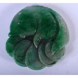 A GREEN JADE ROUNDEL CARVED AS A FISH. 7.3cm diameter, weight 116.8g
