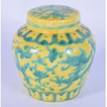 A small Chinese lidded yellow ground ginger jar decorated with dragons 10.5cm.