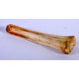 A CARVED BONE SCOOP. 10.5cm long, weight 21.4g