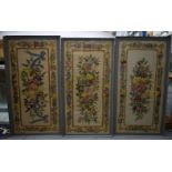A SET OF THREE 19TH CENTURY COUNTRY HOUSE AUBUSSON TYPE EMBROIDERED PANELS depicting flowers. 130 cm