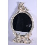 A CONTINENTAL OVAL MIRROR ADORNED WITH CHERUBS. 38cm x 22cm