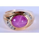 A 14CT GOLD DIAMOND AND PINK STONE RING. 7.1 grams. N/O.