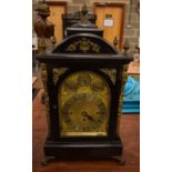 AN ANTIQUE WESTMINSTER CHIMING JOSEPH PENLINGTON OF LIVERPOOL BRACKET CLOCK within an ebonised case.