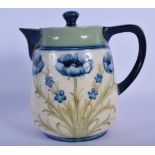 A MOORCROFT MACINTYRE & CO POTTERY TEAPOT AND COVER decorated with flowers. 17 cm x 13 cm.