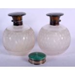 A PAIR OF SILVER AND TORTOISESHELL TOPPED SCENT BOTTLES TOGETHER WITH A SILVER AND ENAMEL PILL BOX.