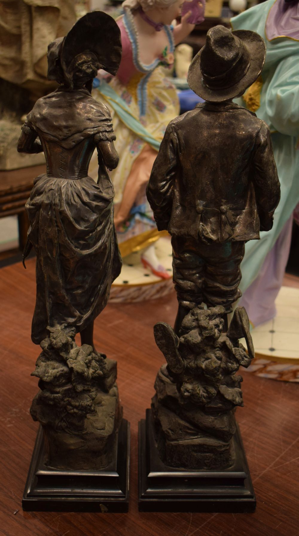 A PAIR OF 19TH CENTURY EUROPEAN SILVERED BRONZE FIGURES modelled as a male and female. 51 cm high. - Image 4 of 4