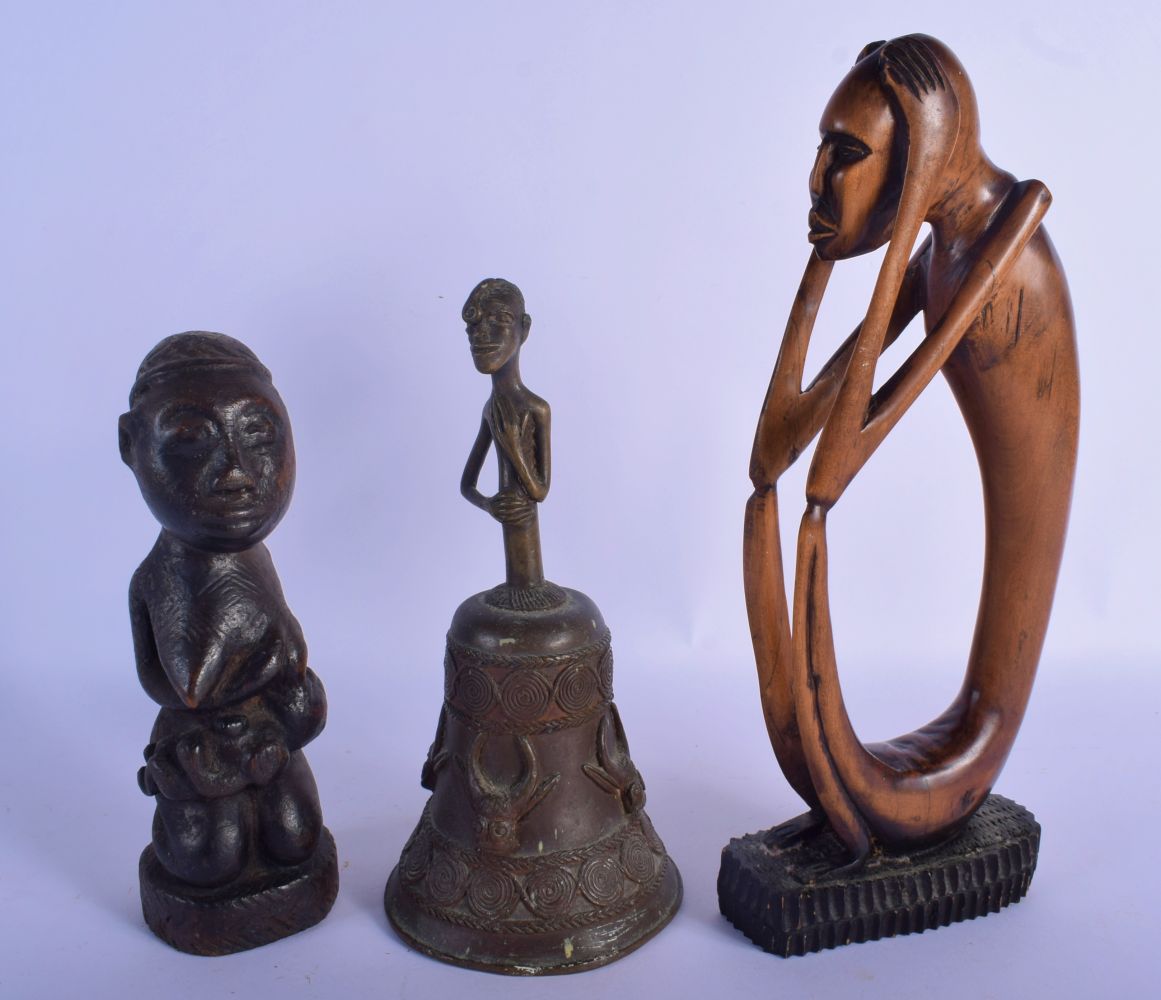 AN EARLY 20TH CENTURY AFRICAN TRIBAL CARVED WOOD FERTILITY FIGURE together with a bronze bell etc. L