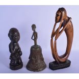 AN EARLY 20TH CENTURY AFRICAN TRIBAL CARVED WOOD FERTILITY FIGURE together with a bronze bell etc. L