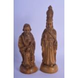 A RARE PAIR OF EARLY 20TH CENTURY CONTINENTAL CARVED WOOD FIGURES possibly chess pieces. Largest 21.