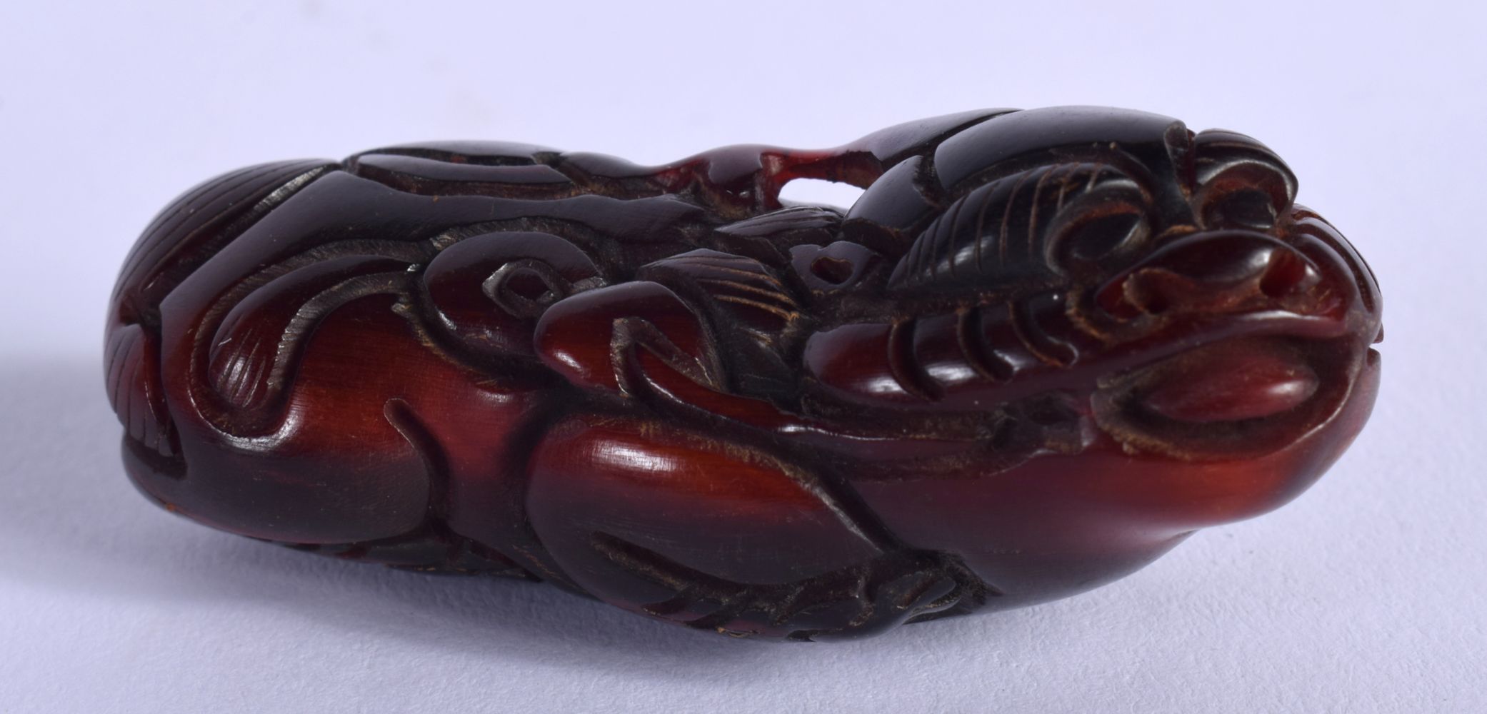 A CARVED DOG OF FOO. 5.5cm x 2.2cm, weight 17.5g