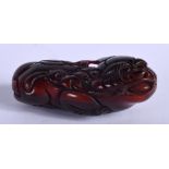 A CARVED DOG OF FOO. 5.5cm x 2.2cm, weight 17.5g
