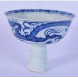 A small Chinese porcelain blue and white stem cup decorated with a dragon 10 x 12 cm