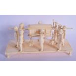 A 19TH CENTURY ANGLO INDIAN CARVED IVORY PROCESSIONAL GROUP modelled with attendants. 21 cm x 9 cm.