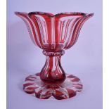 AN ANTIQUE BOHEMIAN PEDESTAL RUBY AND CLEAR GLASS VASE. 16 cm x 14 cm.