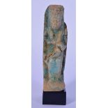 A small Egyptian carved stone statue on a stand 11cm.