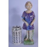 A LOVELY EARLY 20TH CENTURY ENGLISH POTTERY FIGURE OF A FEMALE modelled in purple robes. 29 cm high.