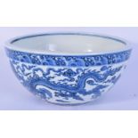 A Chinese porcelain blue and white bowl decorated with dragons. 12 x 27 cm.