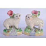 A PAIR OF ANTIQUE CONTINENTAL STAFFORDSHIRE STYLE SHEEP SPILL VASES. 9 cm x 7 cm.