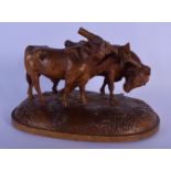 A 19TH CENTURY BAVARIAN BLACK FOREST CARVED DOUBLE COW FIGURE of unusually fine quality, modelled up