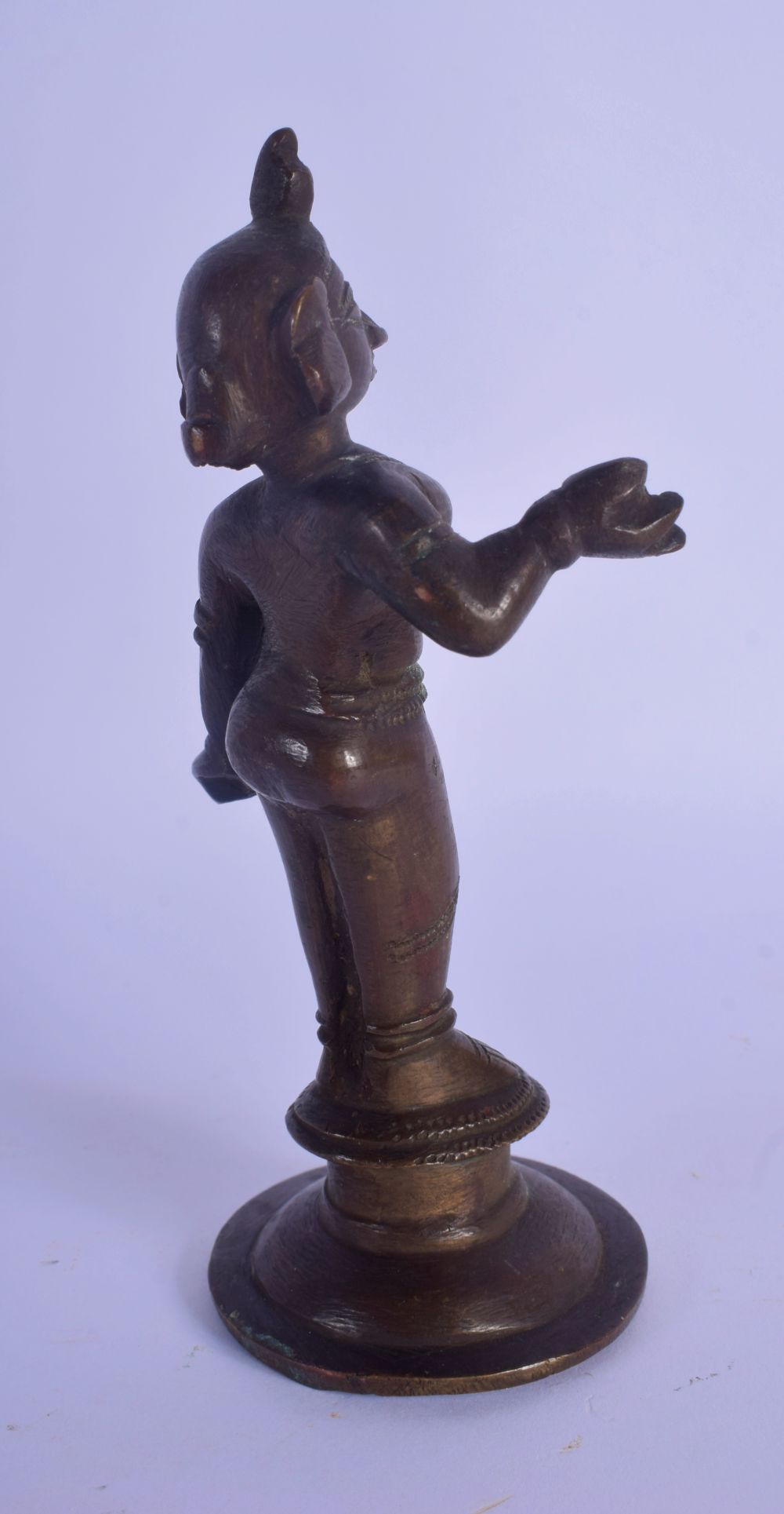 AN 18TH/19TH CENTURY INDIAN BRONZE FIGURE OF A BUDDHA modelled with one hand raised, with red paint - Image 3 of 4