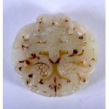 A CHINESE JADE ROUNDEL. 5.6cm diameter. Weight 56.1g