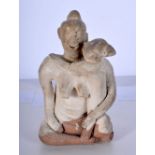An antique Khmer terracotta figure of a female with a child 12 x 8 cm.