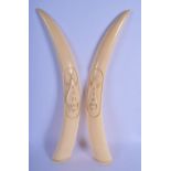 A LARGE PAIR OF EARLY 20TH CENTURY AFRICAN TRIBAL CARVED IVORY TUSKS C1920 overlaid with insects. 48