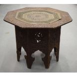 A 19TH CENTURY INDIAN CARVED WOOD TABLE with metal insert. 77 cm x 57 cm.